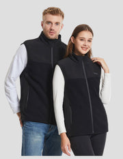 man and woman wearing a 13 Area Black Fleece Heated gilet