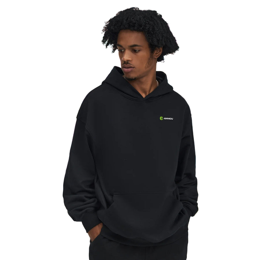 Person wearing a black hoodie with a Anniou logo on a white background