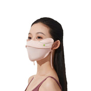 Woman wearing a light pink face mask with a Anniou logo on a white background