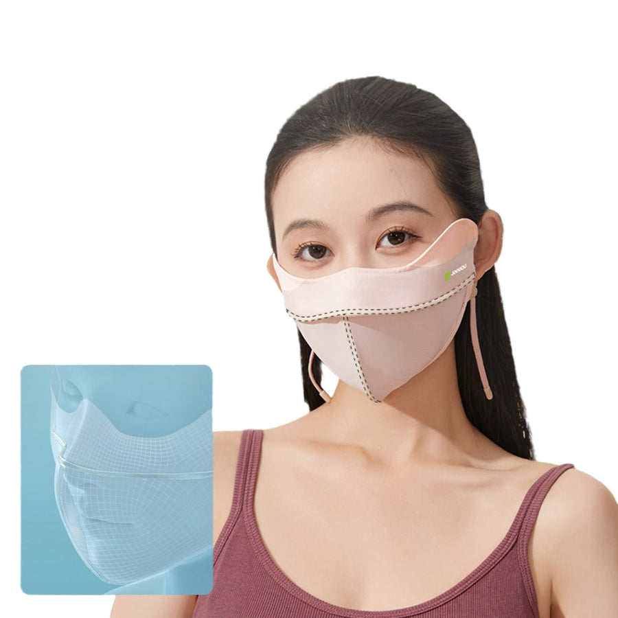 Woman wearing a light pink UPF 50+ sun protective face mask with a clear blue filter pocket on a white background