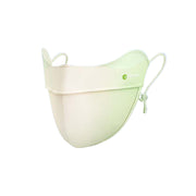 Two-toned face mask with a gradient from beige to green on a white background