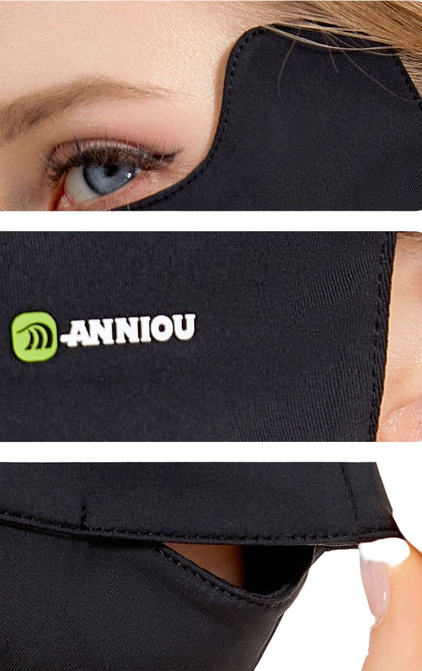 Black face mask with 'Anniou' logo worn by a person, close-up view.
