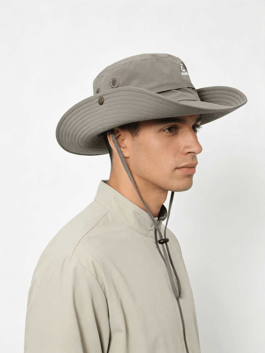 Person wearing a wide-brimmed hat with a white background