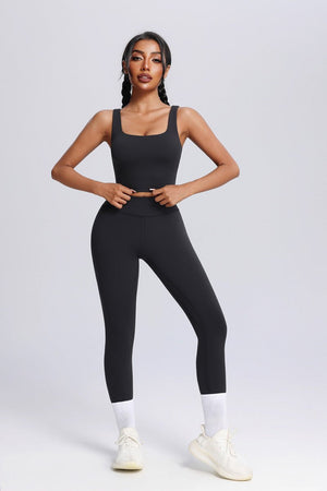 Woman wearing a #black athletic outfit on a white background