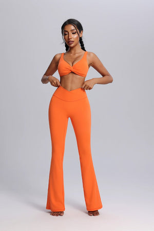 Woman wearing an #orange front twist outfit with a bra and pants