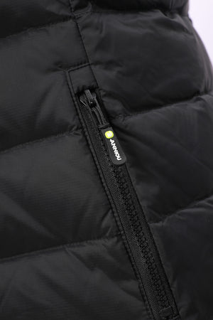Close-up of a black puffer jacket showing a quilted panel and a black zipper with a small yellow-green brand tab reading ANNIOU.