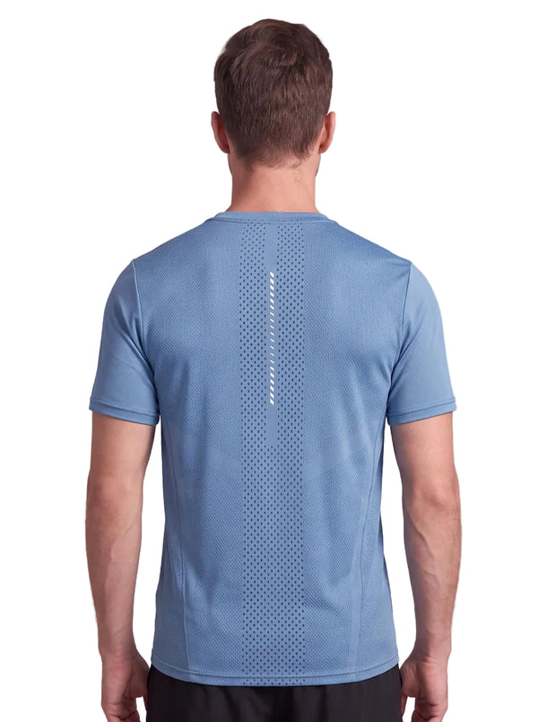 A back-view studio photo of a man wearing a light blue athletic T-shirt, showing the mesh ventilation panel down the center back and a small vertical reflective detail.