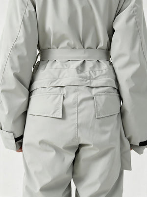 Back‑view studio close‑up of #lightgrey one‑piece ski suit