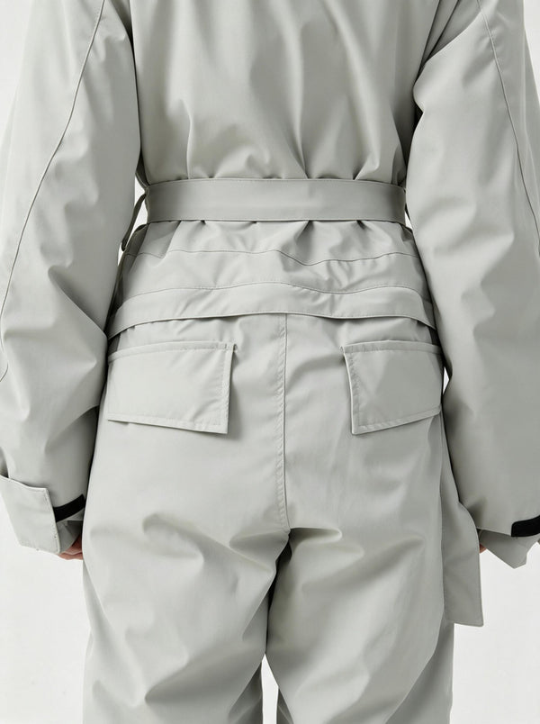Back‑view studio close‑up of #lightgrey one‑piece ski suit