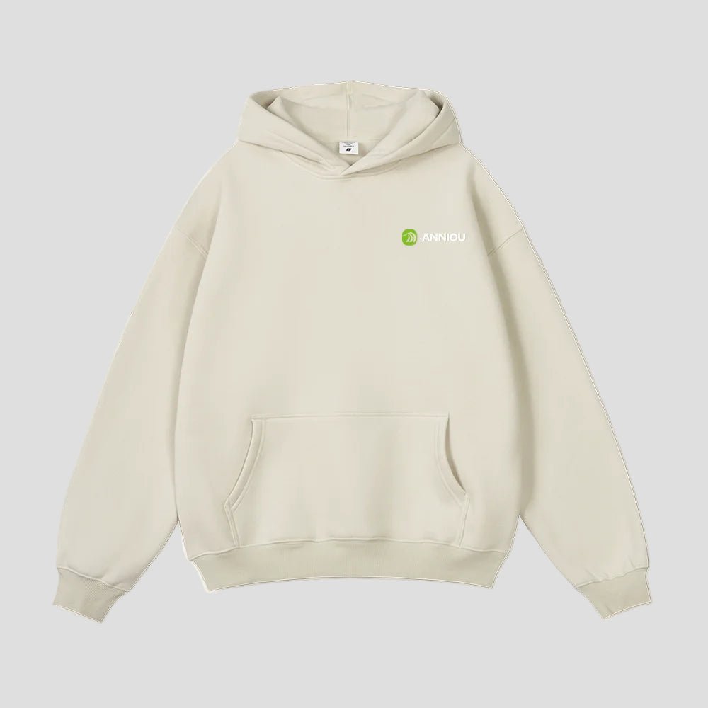 Beige hoodie with Anniou logo on a light beige background