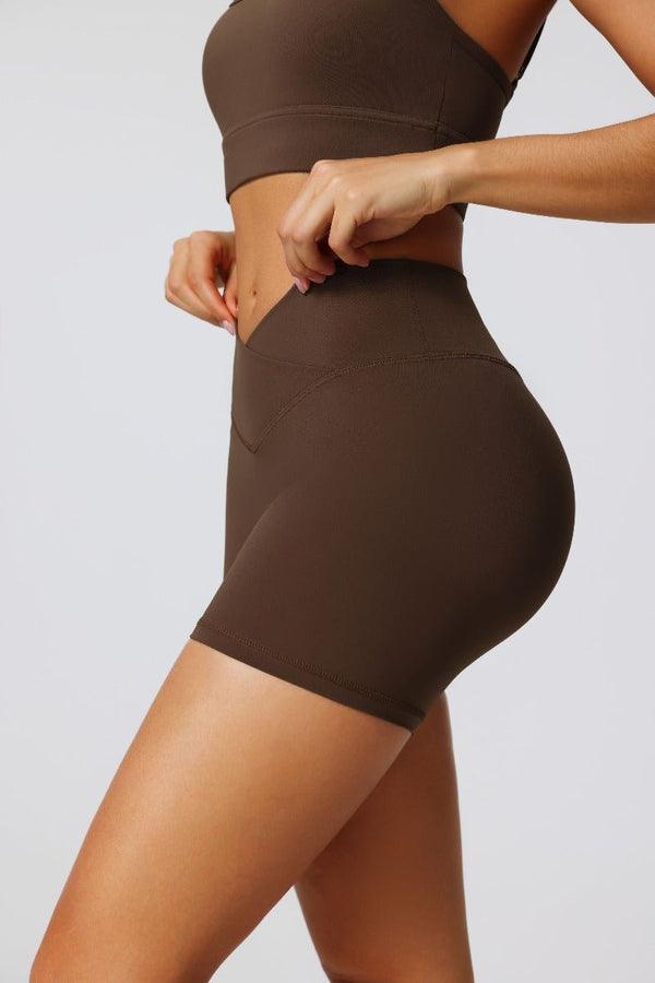 #Brown athletic shorts with crossover design