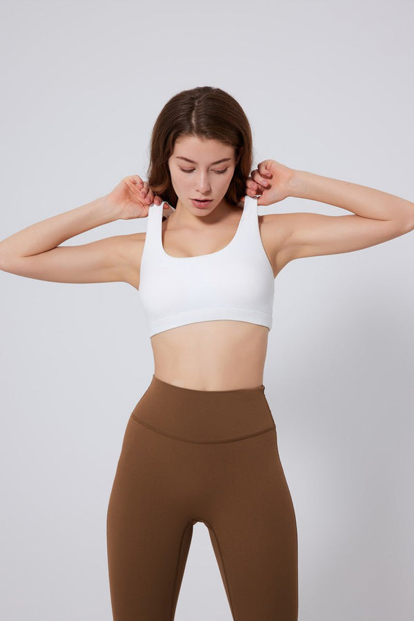 #white Sports Bra and brown leggings