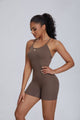 Woman wearing a brown Anniou  bodysuit 