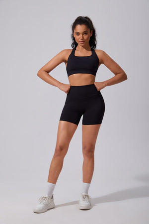 Woman wearing a #black sports bra and shorts