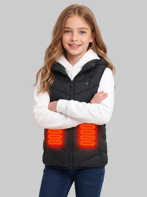 Caucasian pre‑teen girl crossing arms, wearing black hooded kids heated vest with glowing orange abdomen heating panels, matched with white hoodie and jeans,children winter electric warm gilet