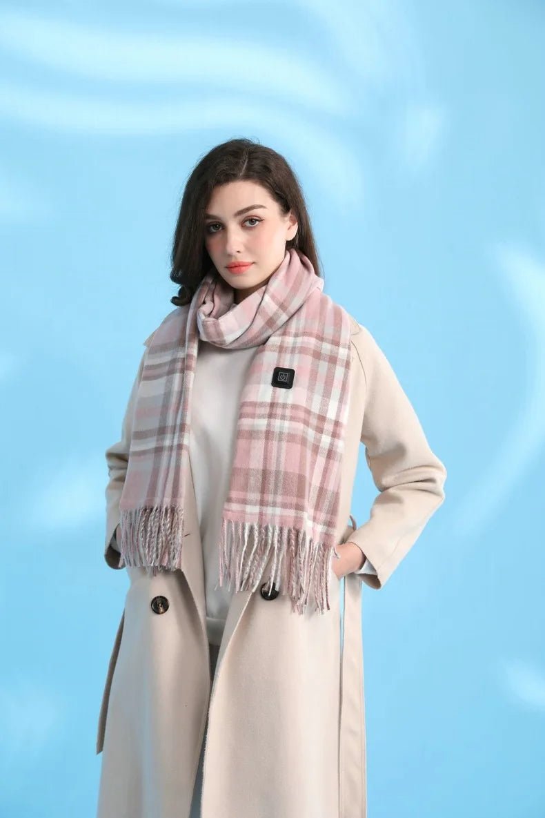 Woman wearing a beige coat and pink plaid scarf against a light blue background