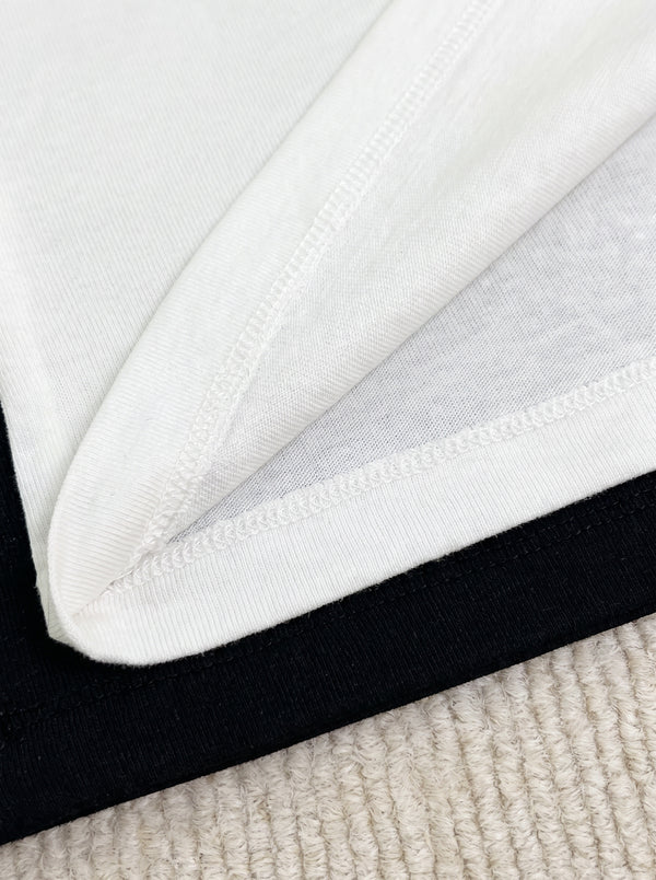 Hem detail of Heart Embroidered Long Sleeve Top