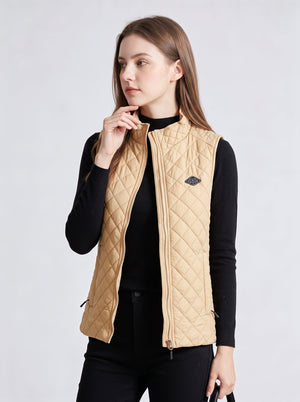 Woman model wearing #khaki diamond quilted sleeveless vest, stand collar zip-up lightweight gilet, plain light gray background, women casual warm outerwear