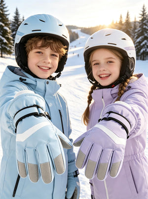 Two happy European‑American kids on a ski slope, boy shows light‑blue kids ski gloves, girl shows purple kids ski gloves, snowy mountain background, bright natural sunlight, close‑up on glove details, winter outdoor scene