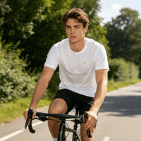 A man wearing a white quick-drying T-shirt is riding a bicycle.