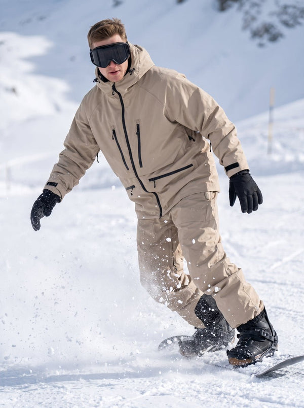 Male snowboarder in full #khaki snow suit and ski goggles, dynamic carving on snowy ski slope, snow splashing, outdoor mountain scene