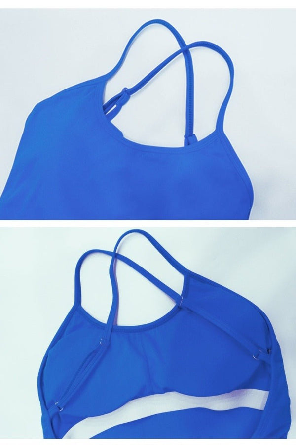 Blue sports bra with thin straps on a light blue background