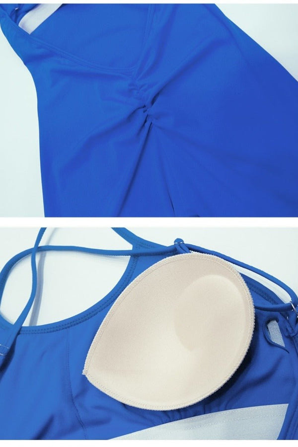 Blue swimsuit top with a beige push-up pad on a white background
