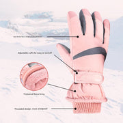 Pink winter gloves with features highlighted on a snowy background