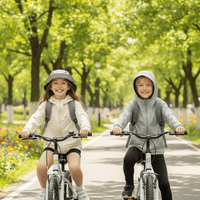 Children wearing sun-protective clothing easily ride bicycles in the park