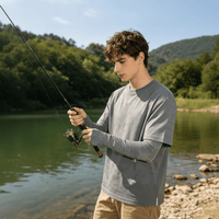 A young man wearing sun protection sleeves was fishing outdoors