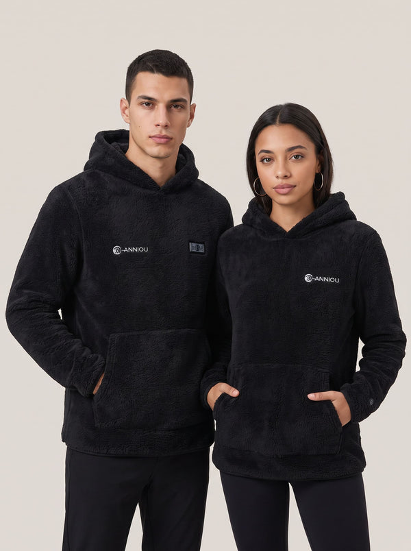 A man and a woman modeling matching black sherpa heated fleece hoodies with a small white 'ANNIOU' logo on the ches