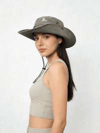 Woman wearing a wide-brimmed hat on a white background