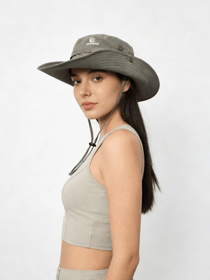 Woman wearing a wide-brimmed hat on a white background