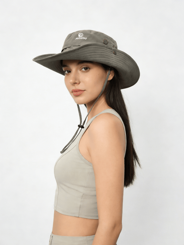 Woman wearing a wide-brimmed hat on a white background