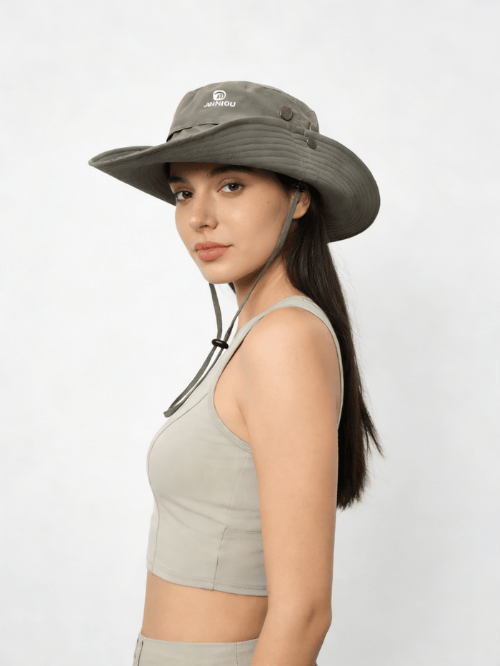 Woman wearing a wide-brimmed hat on a white background