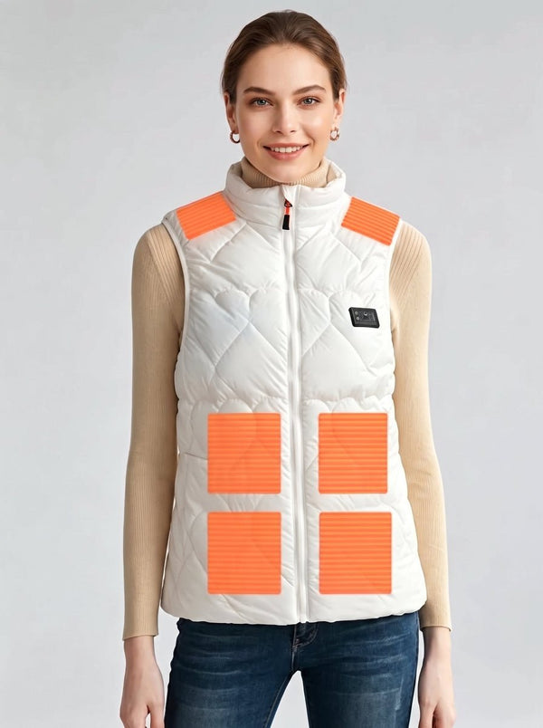 Young european woman wearing white women's heated vest, front view showing 6 orange marked heating zones, stand in light grey studio background, female electric heating gilet