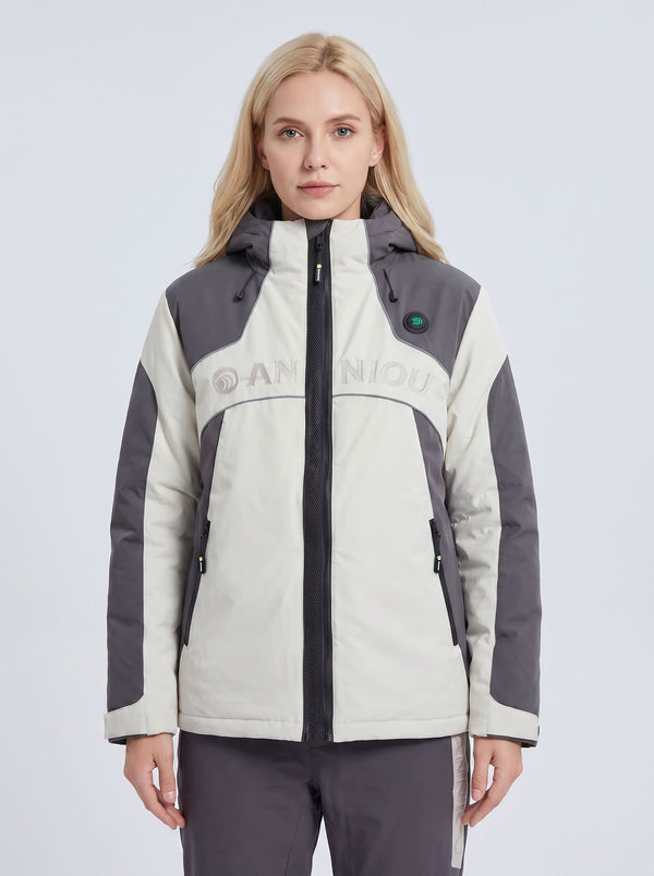 A woman modeling a color-blocked hooded heated ski jacket in off-white and dark gray, featuring a black front zipper, zippered pockets, and a subtle 'ANNIOU' logo across the chest.