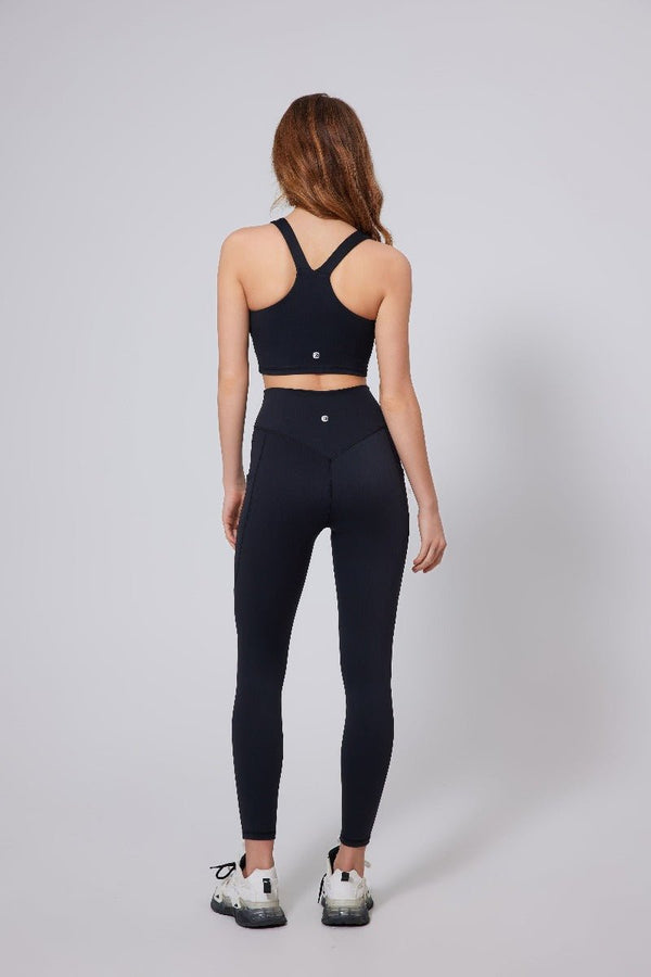 women's #black V-neck racerback  sports bra and high waist leggings with an Anniou logo