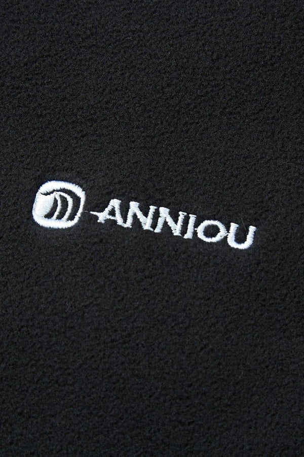 black fabric with 'Anniou' logo embroidered in white.