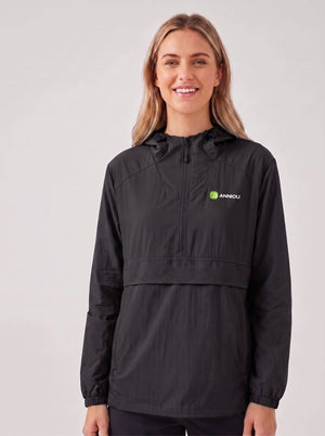 A woman wearing a #black hooded lightweight UV jacket with a front zipper and a small green and white Annou logo on the left chest, photographed against a plain light gray studio background.