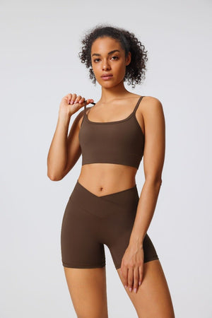 woman wearing a #brown Seamless Sports Bra and yoga shorts