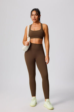 woman wearing a #brown sports bra and leggings 