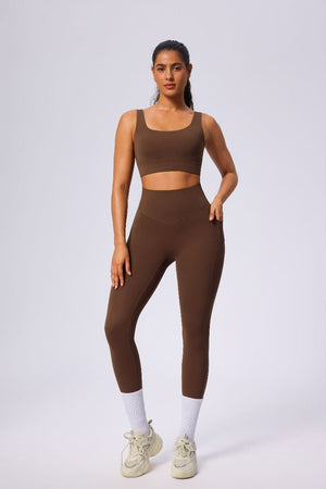 Woman wearing a #brown athletic outfit sports leggings and tank top