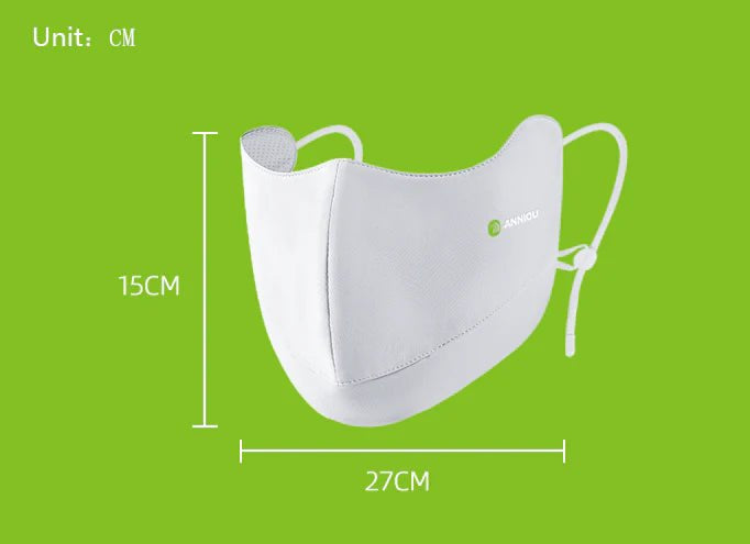 White face mask with measurements on a green background