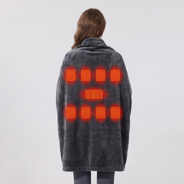 Woman wearing #darkgrey wearable heated blanket viewed from back, showing 9 heating zones marked by orange heat elements