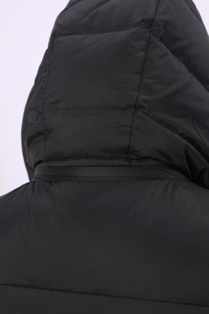 Close-up of the hood and upper back of a black puffer vest, showing quilted stitching and a zippered hood detail 