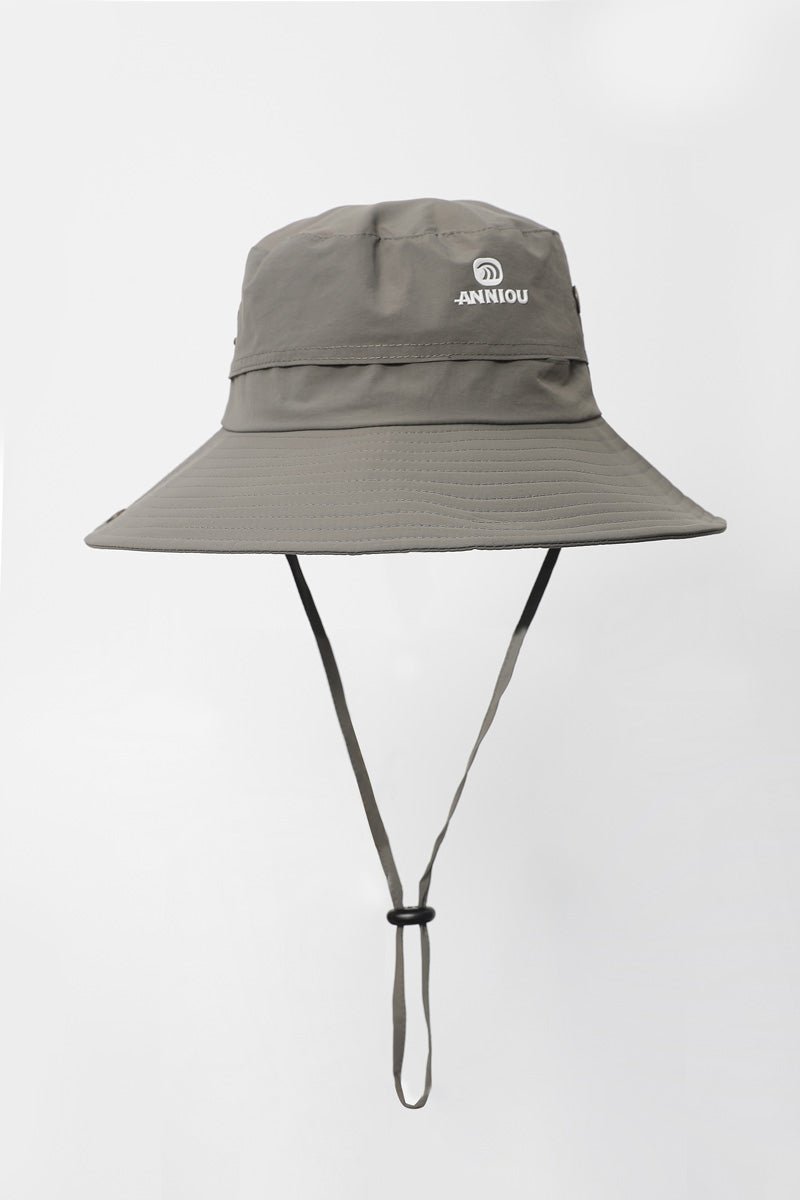 Gray bucket hat with a strap on a light gray background