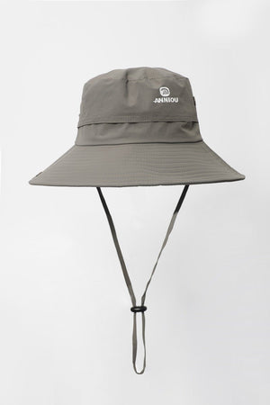 Gray bucket hat with a strap on a light gray background
