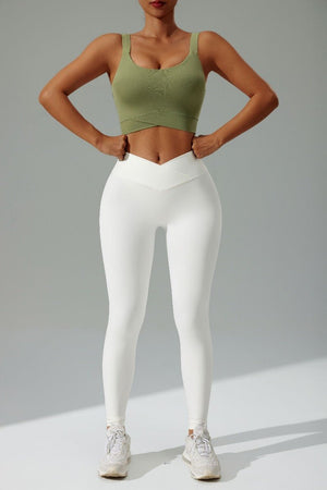 Women's #green High Strength Sports Bra and white high waist criss cross leggings