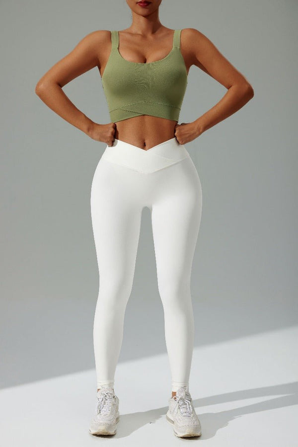 Women's #green High Strength Sports Bra and white high waist criss cross leggings